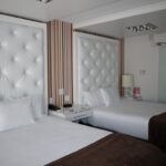 hotel room white beds